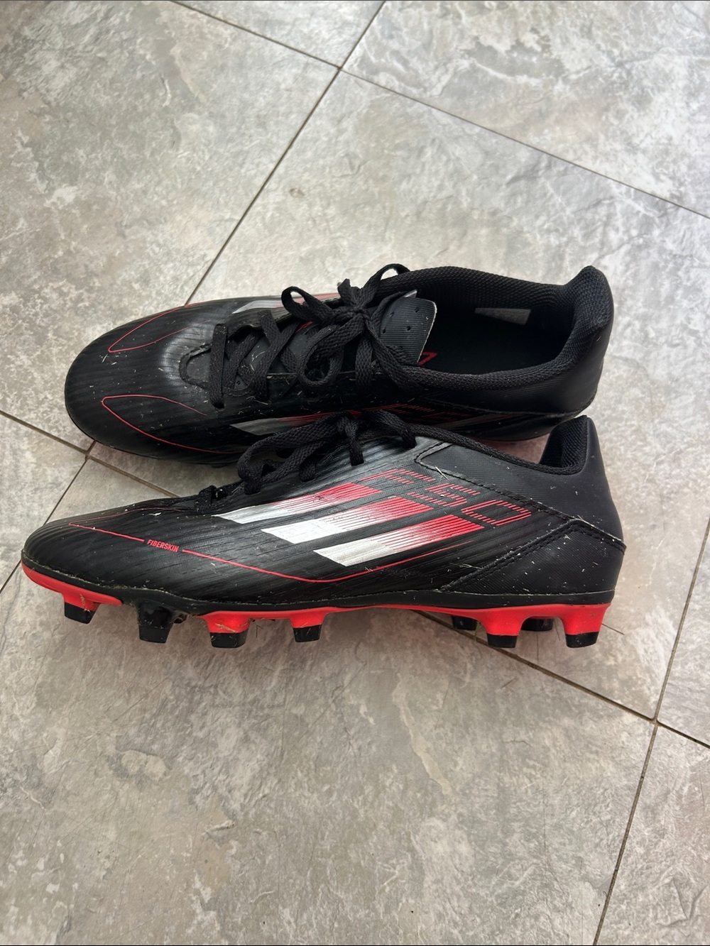 Kids Black and Red Soccer Cleats - Lightweight Firm-Ground Shoe